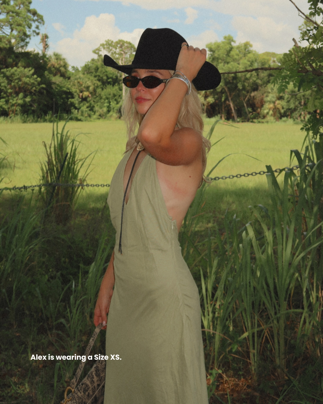 The Kelly Backless Halter Slip Dress- a halter neck maxi that offers a classic and airy fit. Available at our Naples & Bonita Springs boutiques or online.