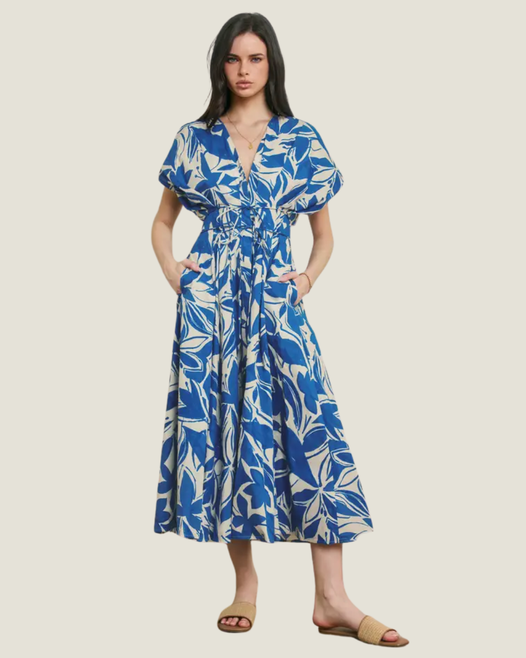 Blue and white tropical floral inspired mini dress with cinched waist.