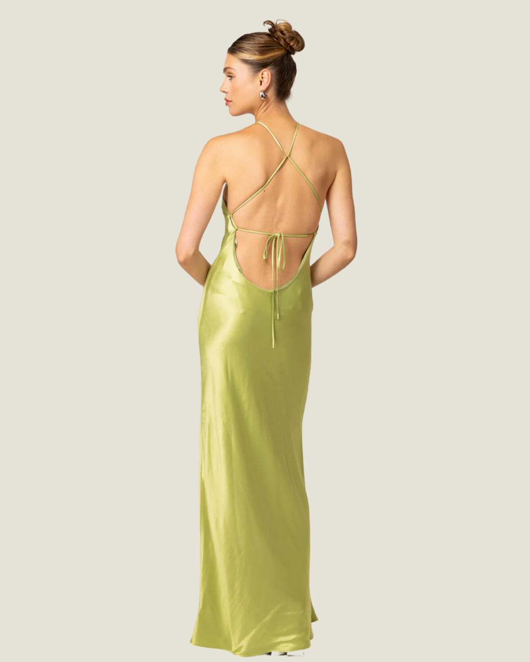 The Lima- lime halter satin maxi dress from Love Celine women’s boutique in SWFL.