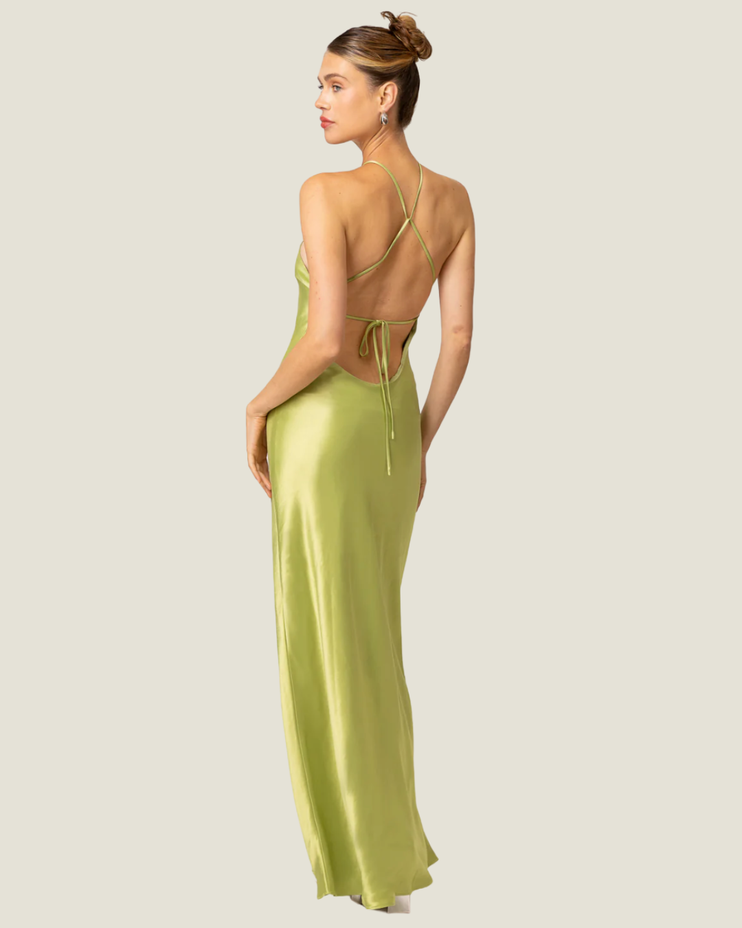 The Lima- lime halter satin maxi dress from Love Celine women’s boutique in SWFL.