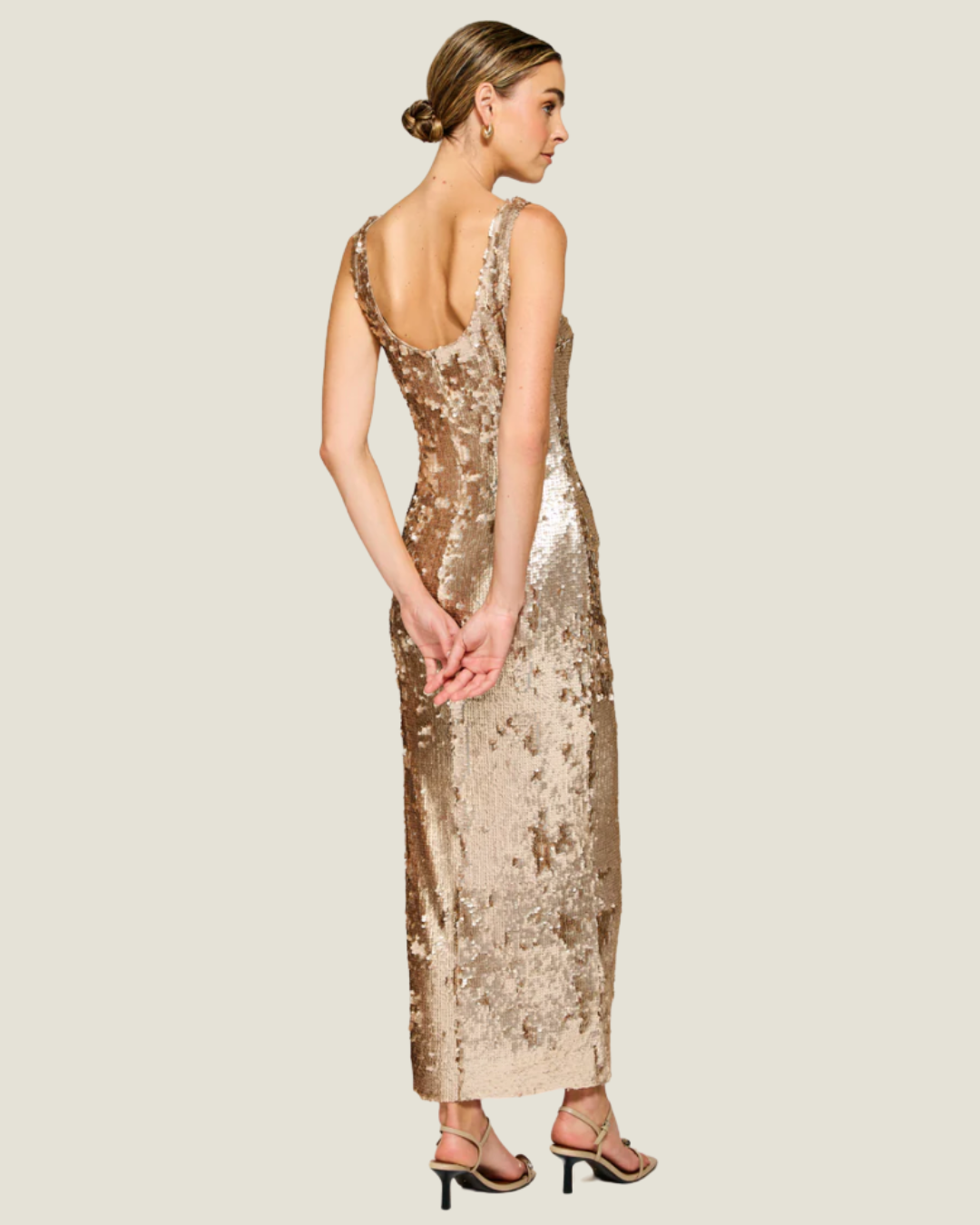 The Naida- a sequin midi dress from Love Celine women’s boutique in SWFL.