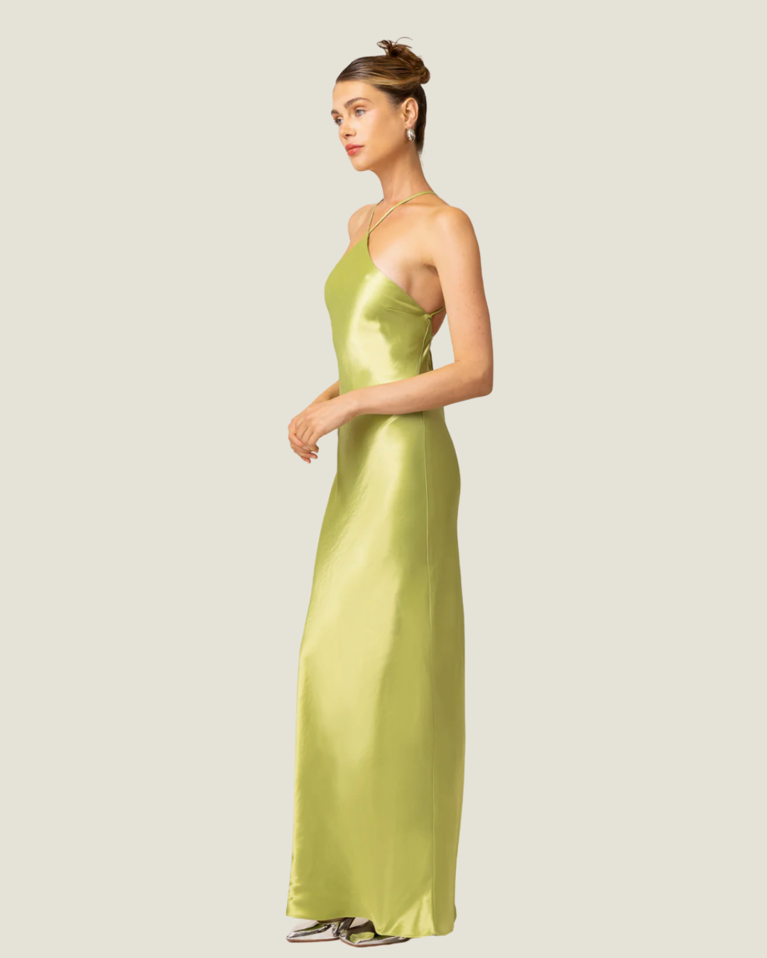 The Lima- lime halter satin maxi dress from Love Celine women’s boutique in SWFL.