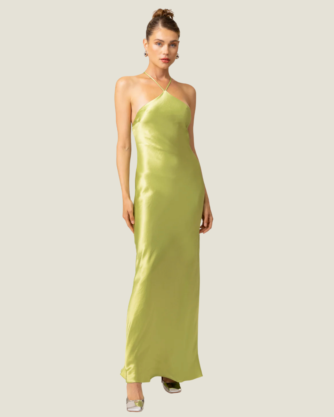 The Lima- lime halter satin maxi dress from Love Celine women’s boutique in SWFL.