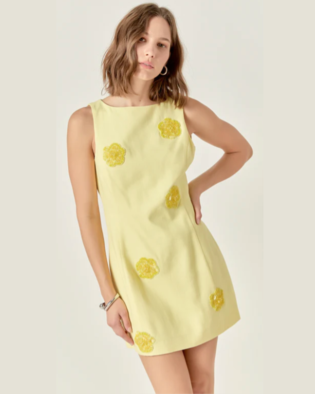 Jayden Embellished Linen Mini Dress- a butter yellow mini dress made with floral embellished detail. Available at Love Celine a women’s boutique in SWFL.
