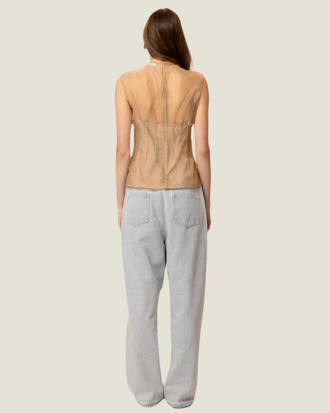 Elfreda Sheer Sleeveless Pleated Blouse is a modern capsule wardrobe piece with a round neck line & flattering length!