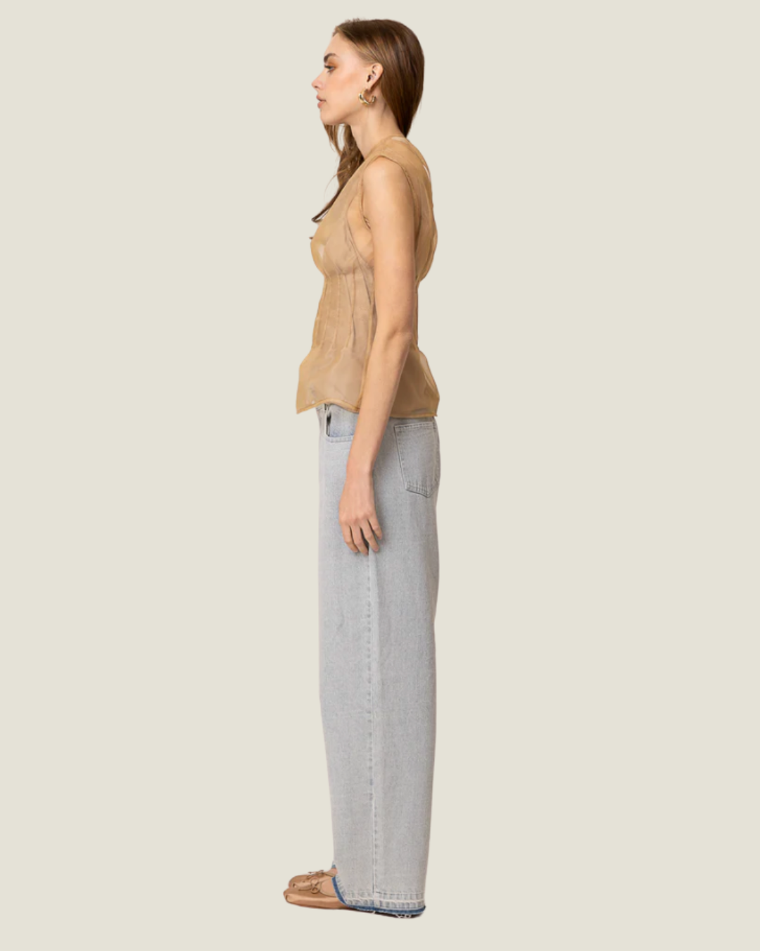 Elfreda Sheer Sleeveless Pleated Blouse is a modern capsule wardrobe piece with a round neck line & flattering length!