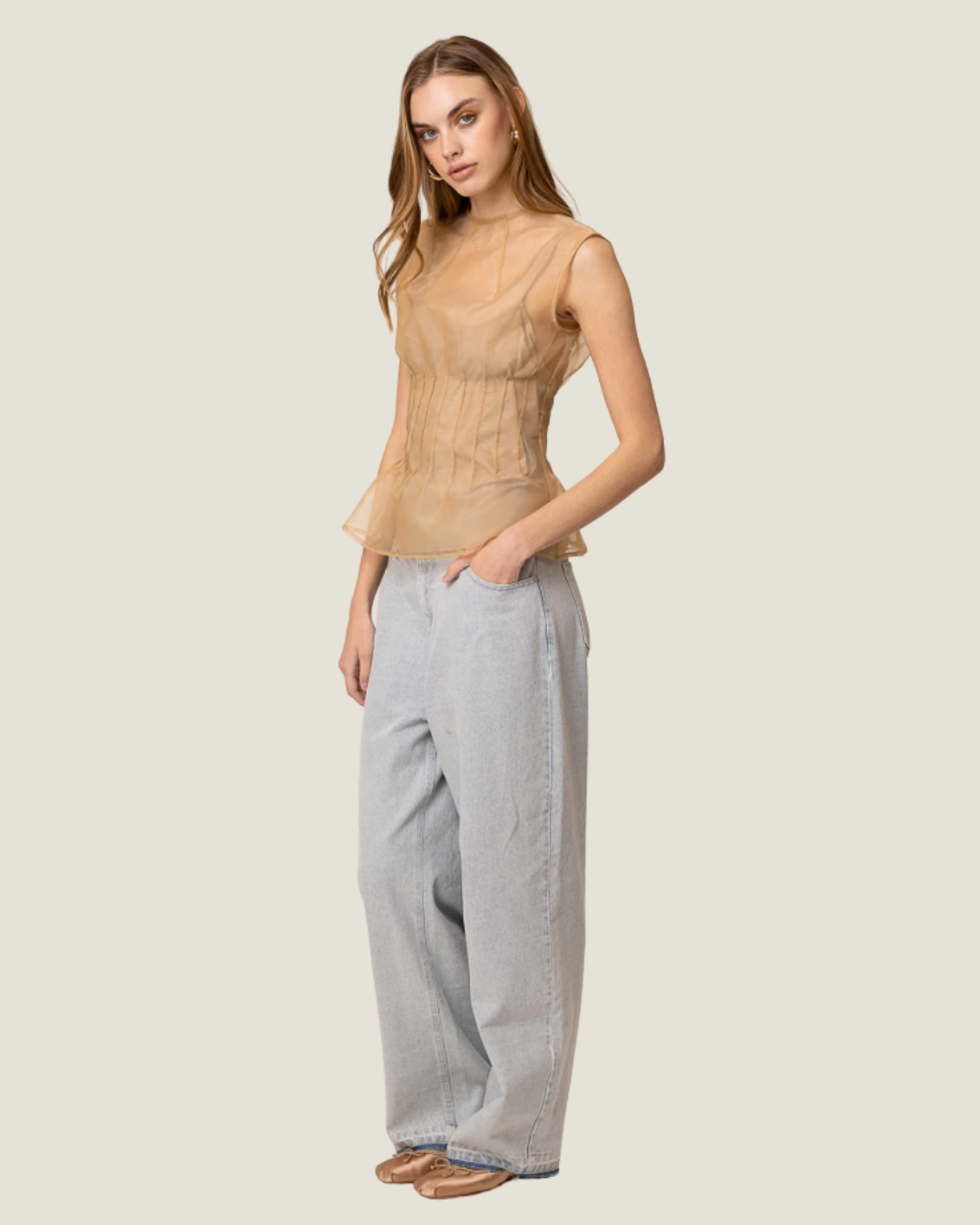 Elfreda Sheer Sleeveless Pleated Blouse is a modern capsule wardrobe piece with a round neck line & flattering length!