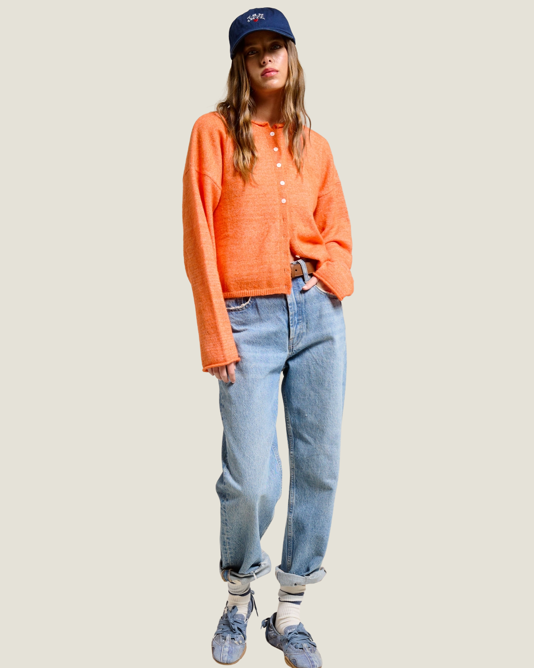 Orange slightly knit oversized cardigan. 