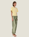 Women's taffeta drawstring pants with a relaxed fit, adjustable waist, tie-leg detailing, and patch pockets.