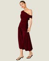 Women's Arabella Burgundy Maxi Dress featuring an asymmetrical off-the-shoulder neckline, ruched fitted bodice, and flowing skirt