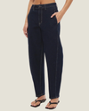 Women's Cora Barrel Leg Jeans featuring a relaxed high-rise fit, curved leg silhouette, panelled denim construction, and contrast topstitching.