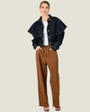 Women's Roxie Cape Jacket featuring a structured twill silhouette, optional cape detail, classic collar, button cuffs, and flap front pockets.