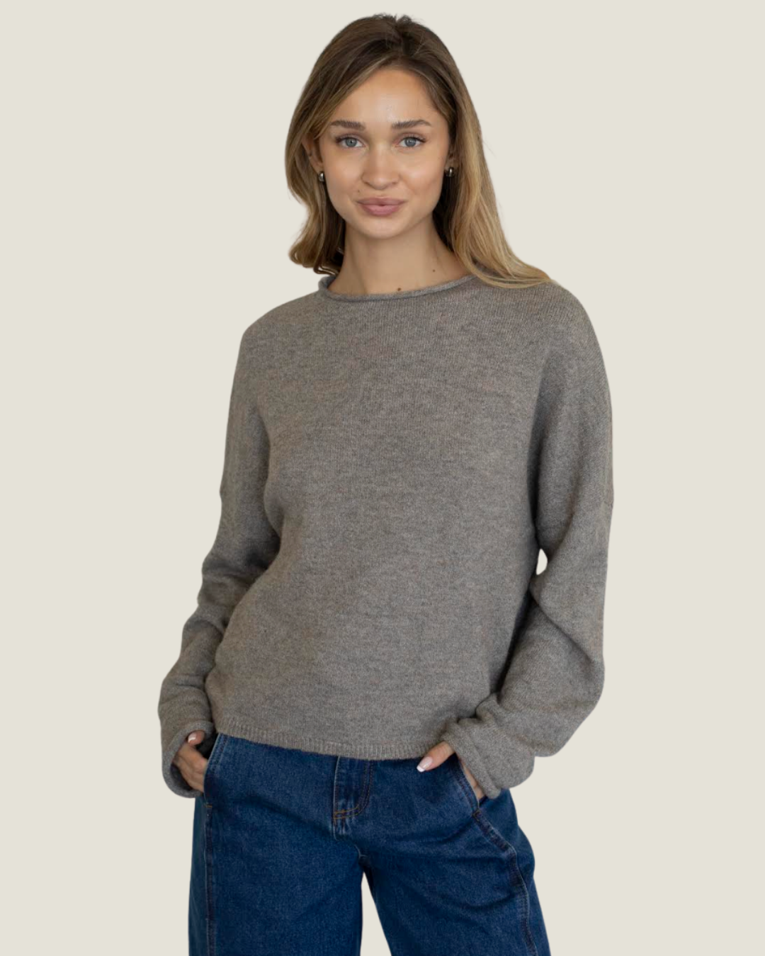 Mocha knit slightly oversized sweater with rolled neckline. 