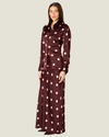 Women's polka dot satin button-up top with a collared neckline, shell buttons, long sleeves, and adjustable lace-up corset back