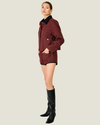 Women's Norma Check Jacket featuring a classic check pattern, contrast collar, long sleeves, snap-button closure, and front pocket.