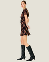 Women's Kristopher Plaid Mini Dress by Line & Dot featuring a plaid print, mock neckline, short sleeves, lace trim, and asymmetric hem.
