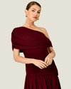 Women's Arabella Burgundy Maxi Dress featuring an asymmetrical off-the-shoulder neckline, ruched fitted bodice, and flowing skirt