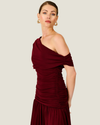 Women's Arabella Burgundy Maxi Dress featuring an asymmetrical off-the-shoulder neckline, ruched fitted bodice, and flowing skirt