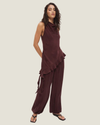 Women's Eadie Asymmetrical Draped Top in green and purple, featuring a silky satin finish, cowl neckline, and statement asymmetric flounce hem.