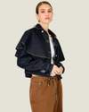 Women's Roxie Cape Jacket featuring a structured twill silhouette, optional cape detail, classic collar, button cuffs, and flap front pockets.