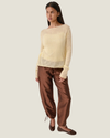 Women's taffeta drawstring pants with a relaxed fit, adjustable waist, tie-leg detailing, and patch pockets.