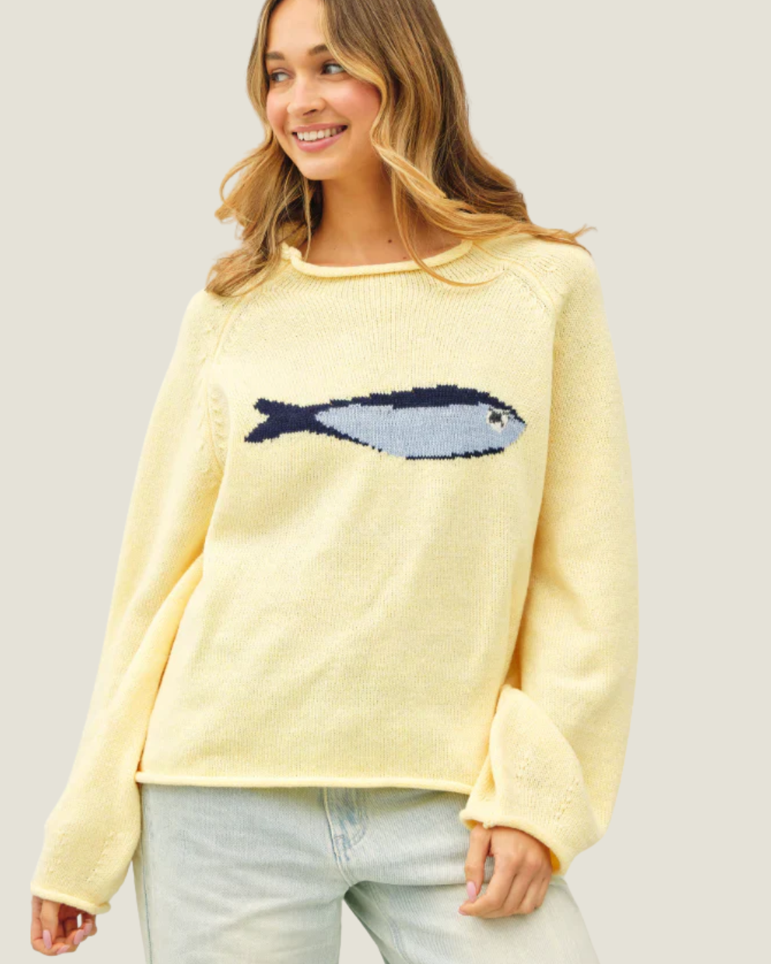 Butter yellow knit oversized sweater with knitted sardine design.