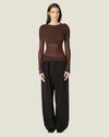Everleigh Sheer Mesh Top featuring a body-skimming silhouette, long sleeves, draped shoulder overlay, and ruched detailing.