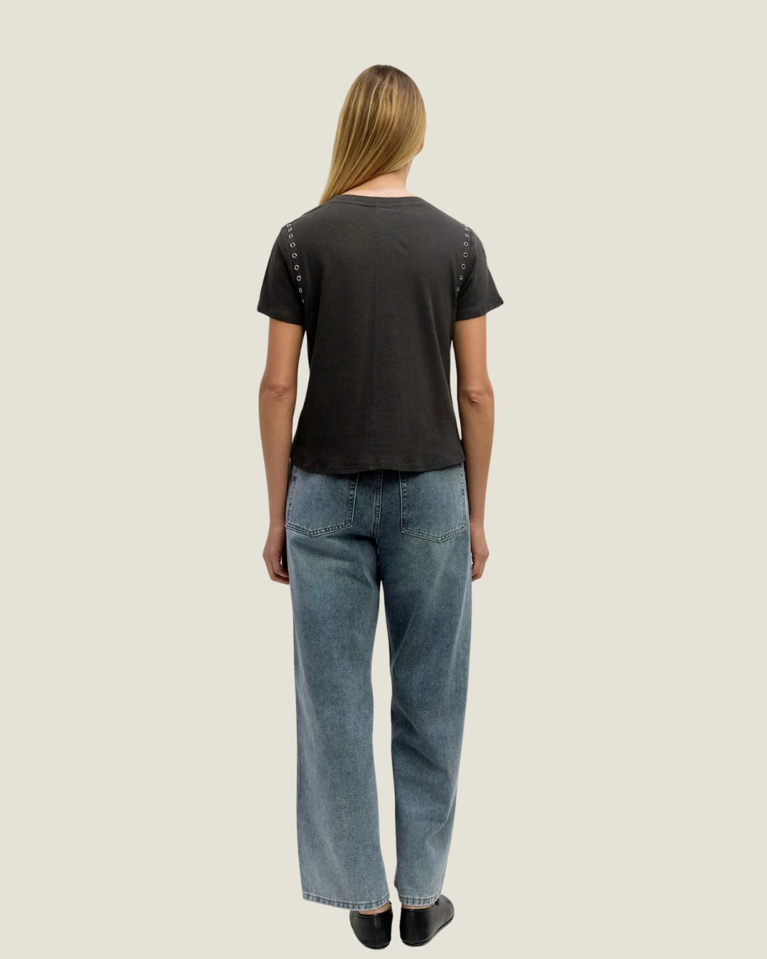 Black relaxed fit t-shirt with rivet detailing around armholes.