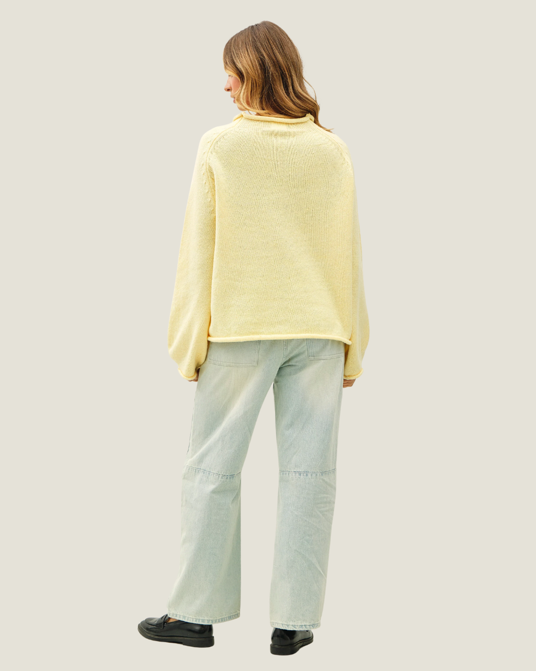 Butter yellow knit oversized sweater with knitted sardine design. 