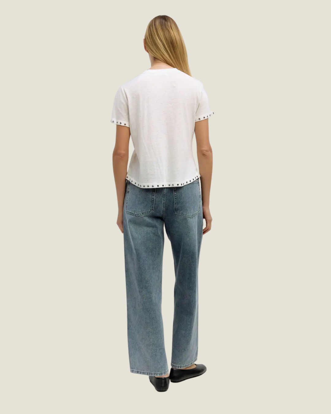Classic white tee with rivet detailing on the hem. 
