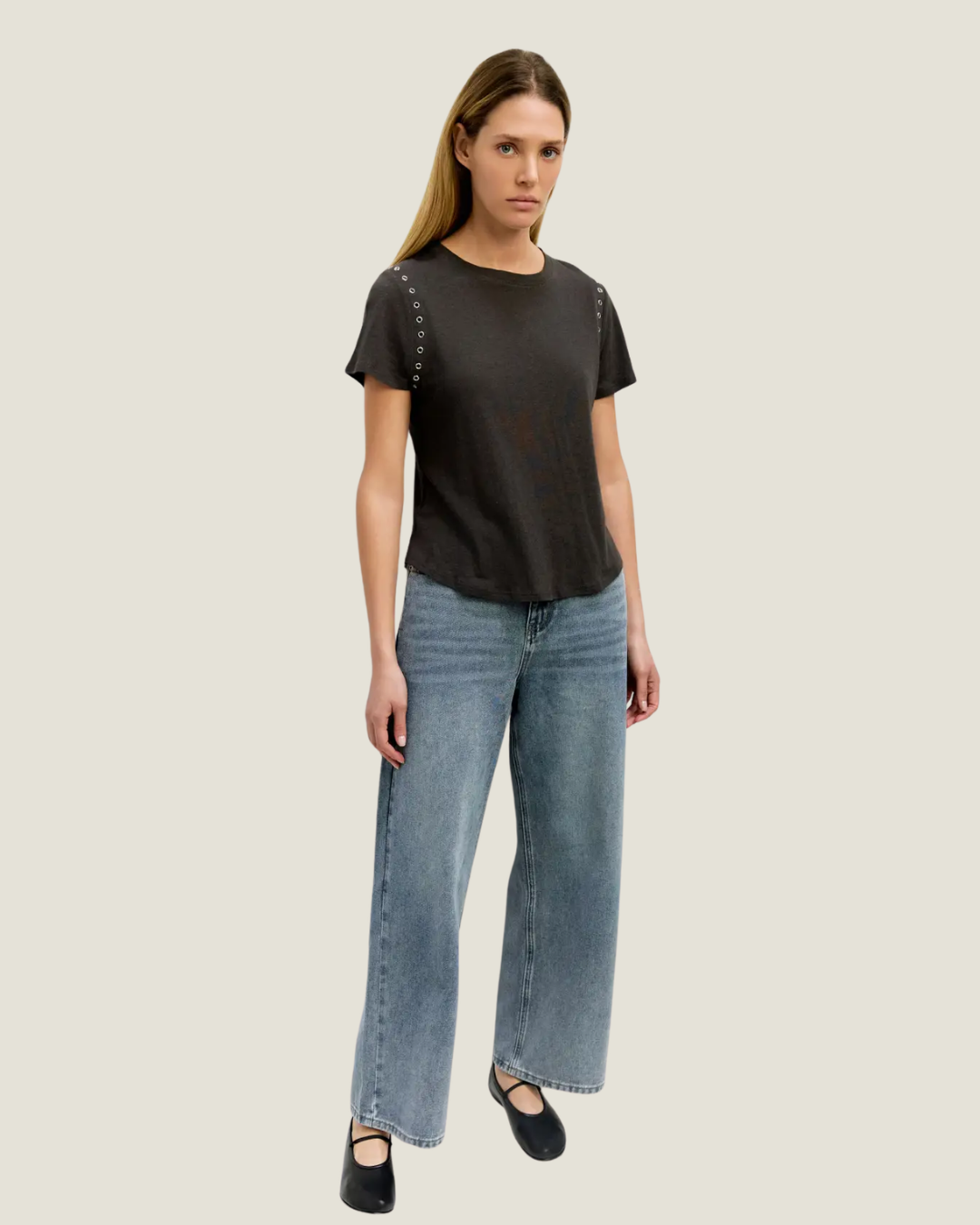 Black relaxed fit t-shirt with rivet detailing around armholes.