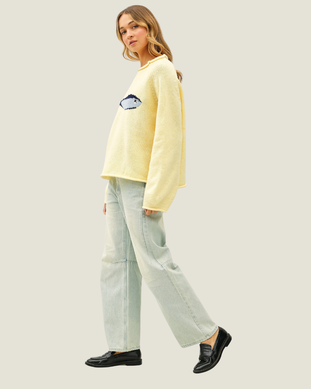 Butter yellow knit oversized sweater with knitted sardine design. 