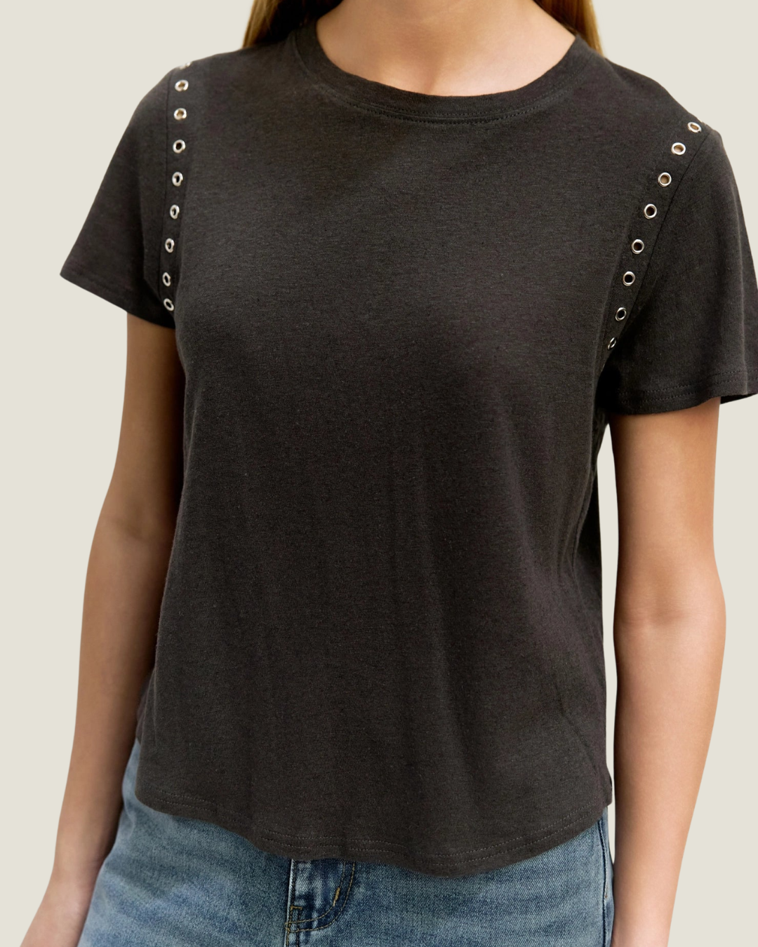 Black relaxed fit t-shirt with rivet detailing around armholes.