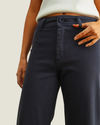 Moroney Straight Wide Leg Pants in Navy featuring a flattering high-rise waist, straight wide-leg silhouette, and ankle-length hem.