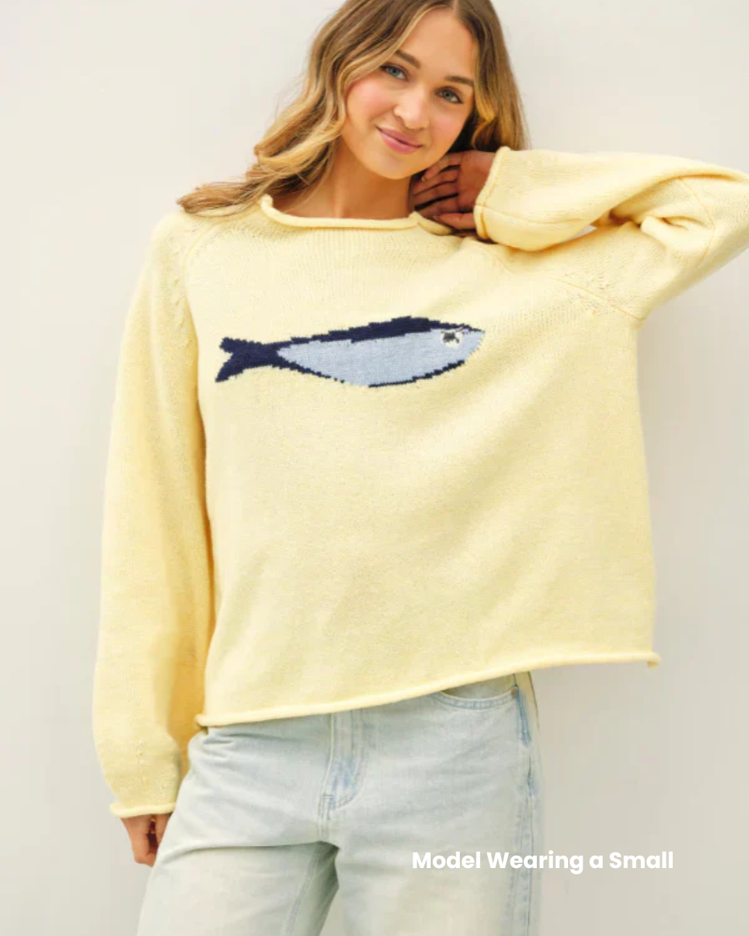 Butter yellow knit oversized sweater with knitted sardine design. 
