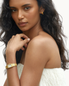 Bella Watch from the Bellissima Watch Collection featuring a vintage-inspired design, gold-plated stainless steel finish, and slim clasped strap.