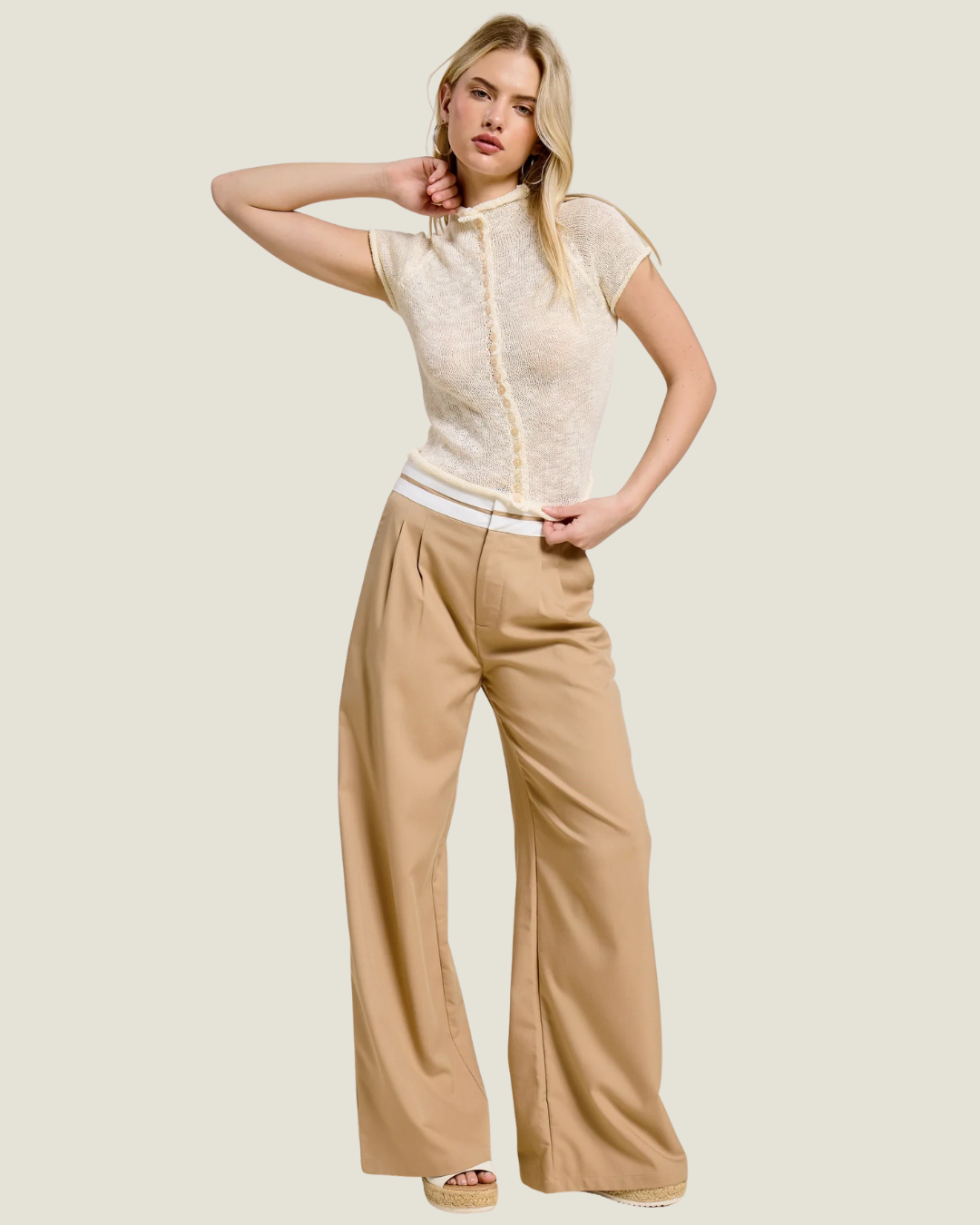 White sheer mock-neck button detailed top.