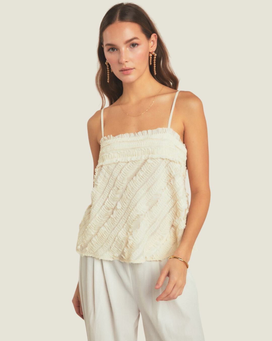 The 167: Cream Ruffled Sleeveless Top