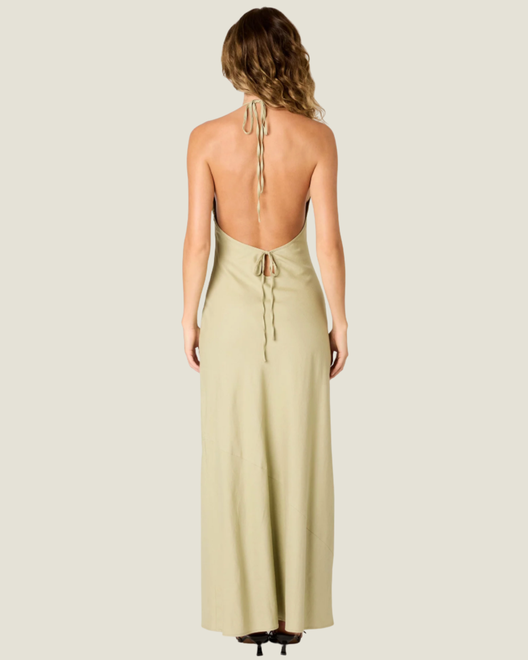 The Kelly Backless Halter Slip Dress- a halter neck maxi that offers a classic and airy fit. Available at our Naples & Bonita Springs boutiques or online.