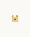 Matilde Cuff by Heaven Mayhem in gold with a deep burgundy enamel center and bold architectural design.
 Copy alt text