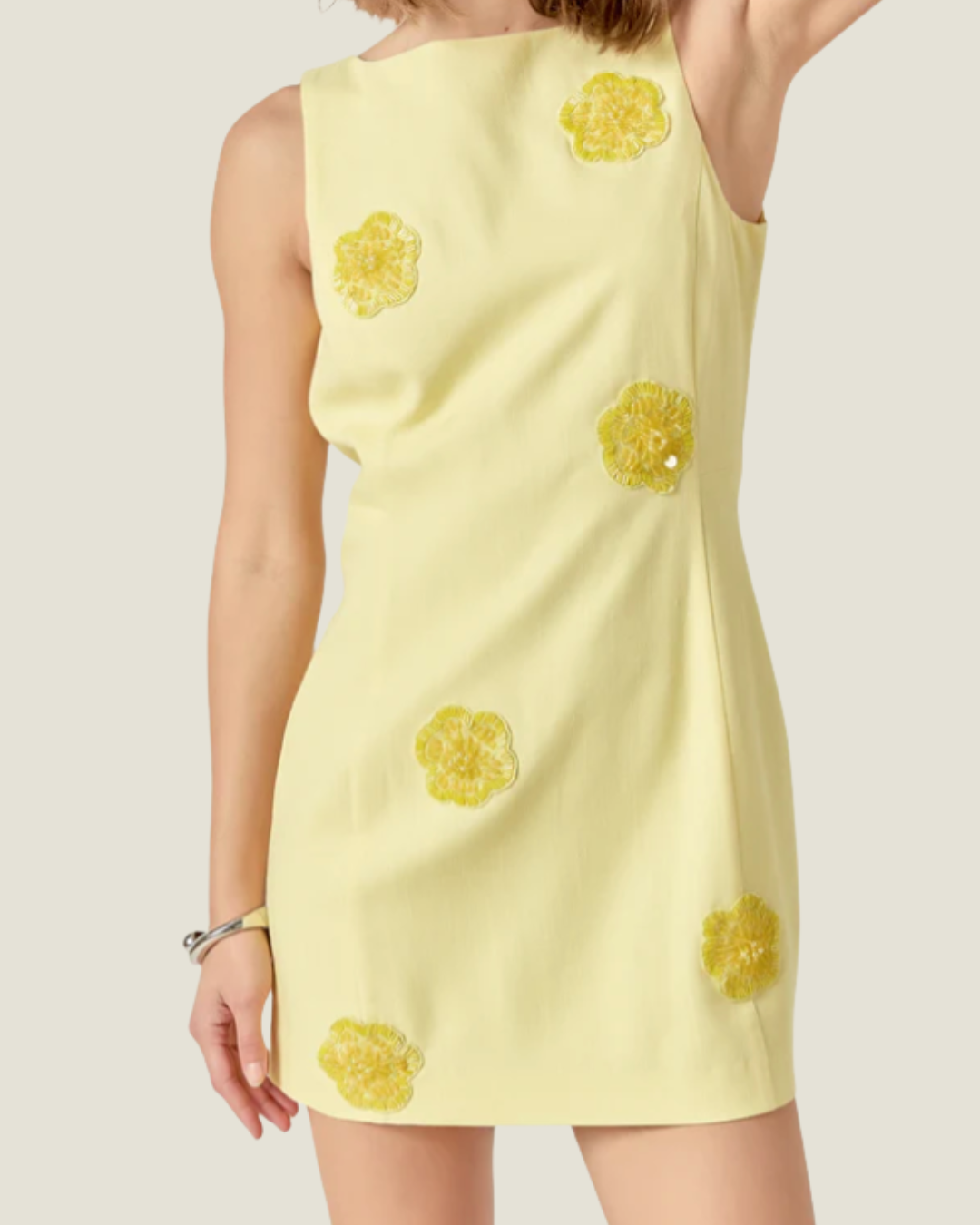 Jayden Embellished Linen Mini Dress- a butter yellow mini dress made with floral embellished detail. Available at Love Celine a women’s boutique in SWFL.