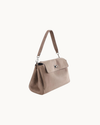 Fossil suede Vela shoulder bag with silver hardware detailing and a sleek, structured silhouette.