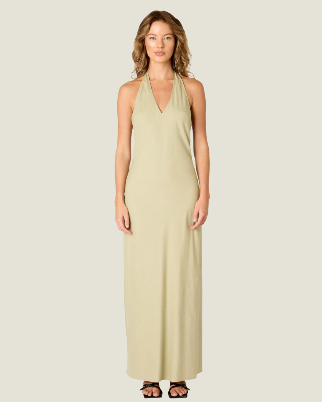 The Kelly Backless Halter Slip Dress- a halter neck maxi that offers a classic and airy fit. Available at our Naples & Bonita Springs boutiques or online.