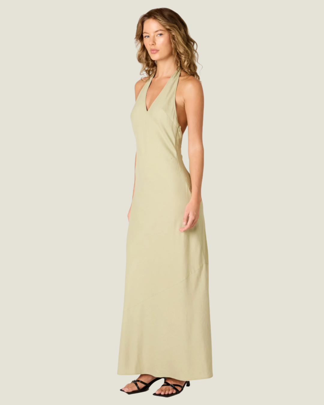 The Kelly Backless Halter Slip Dress- a halter neck maxi that offers a classic and airy fit. Available at our Naples & Bonita Springs boutiques or online.