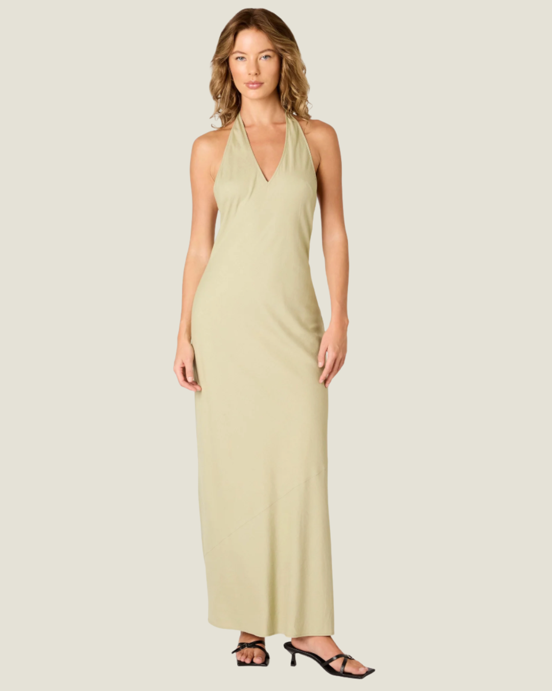 The Kelly Backless Halter Slip Dress- a halter neck maxi that offers a classic and airy fit. Available at our Naples & Bonita Springs boutiques or online.