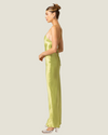 The Lima- lime halter satin maxi dress from Love Celine women’s boutique in SWFL.
