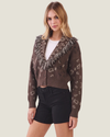 Brown women's fringe cardigan featuring long sleeves, statement fringe detailing, and a classic button-down front.