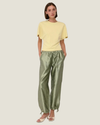 Women's taffeta drawstring pants with a relaxed fit, adjustable waist, tie-leg detailing, and patch pockets.