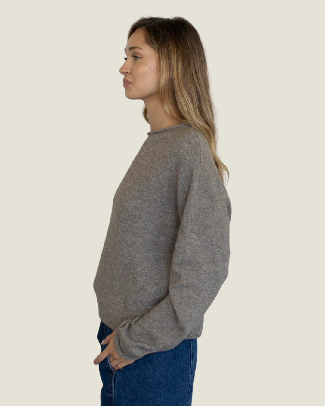 Mocha knit slightly oversized sweater with rolled neckline. 