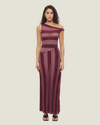 One-shoulder knit maxi dress with multi-directional stripes, twisted off-shoulder strap, and side leg split.